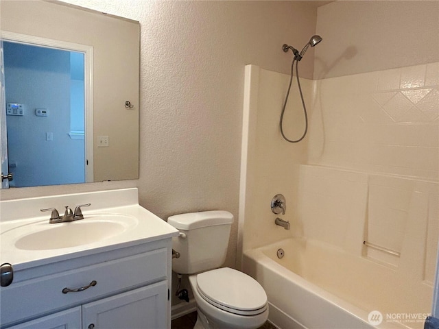 9002 Shadberry Dr SE, Olympia, WA 98513 - full bath featuring toilet, tub / shower combination, vanity, and a textured wall