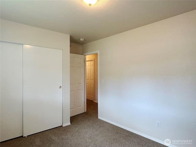 9002 Shadberry Dr SE, Olympia, WA 98513 - unfurnished bedroom with carpet floors, a closet, and baseboards
