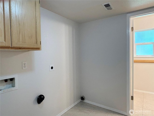 9002 Shadberry Dr SE, Olympia, WA 98513 - washroom featuring cabinet space, baseboards, light tile patterned flooring, hookup for a washing machine, and hookup for an electric dryer
