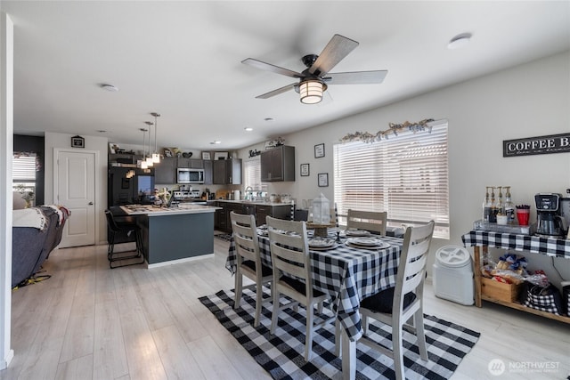 15028 Iverson Loop SE, Yelm, WA 98597 - dining area with ceiling fan and light wood-style floors