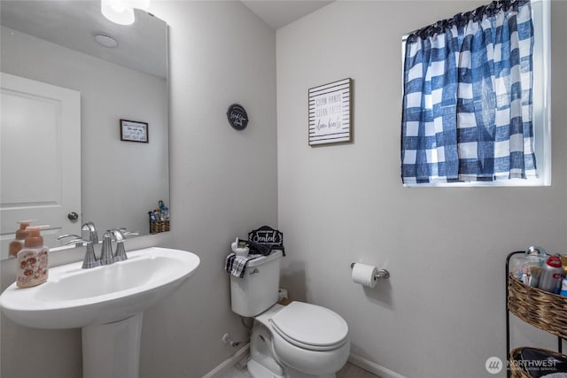 15028 Iverson Loop SE, Yelm, WA 98597 - half bath with baseboards, toilet, and a sink
