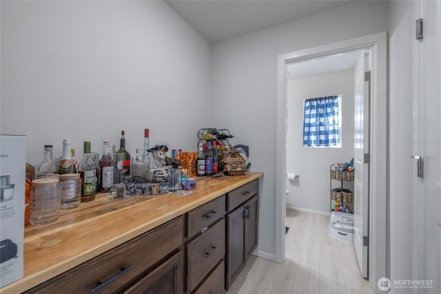 15028 Iverson Loop SE, Yelm, WA 98597 - indoor dry bar featuring light wood-style floors and baseboards