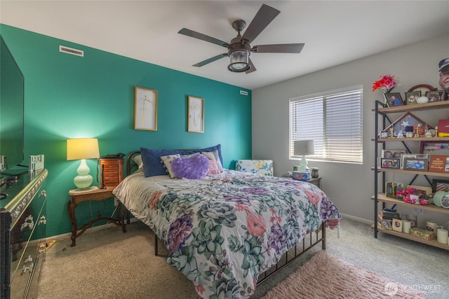 15028 Iverson Loop SE, Yelm, WA 98597 - carpeted bedroom with baseboards and ceiling fan