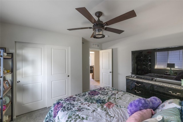 15028 Iverson Loop SE, Yelm, WA 98597 - bedroom featuring carpet flooring, a closet, and a ceiling fan