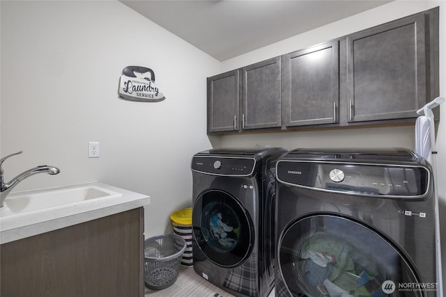 15028 Iverson Loop SE, Yelm, WA 98597 - laundry room with cabinet space and independent washer and dryer