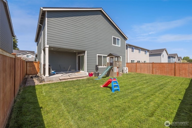 15028 Iverson Loop SE, Yelm, WA 98597 - rear view of house featuring a playground and a patio area