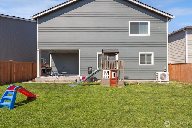 15028 Iverson Loop SE, Yelm, WA 98597 - back of house with a cooling unit, a playground, and a patio area