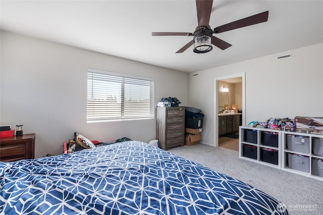 15028 Iverson Loop SE, Yelm, WA 98597 - bedroom featuring carpet flooring, connected bathroom, and ceiling fan