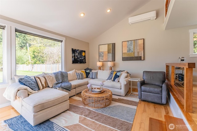 2 Greene Point Rd, Bellingham, WA 98229 - living area featuring a wall mounted air conditioner, wood finished floors, recessed lighting, baseboards, and a fireplace