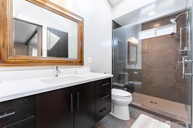 2 Greene Point Rd, Bellingham, WA 98229 - bathroom featuring toilet, vanity, tiled shower, and tile patterned flooring