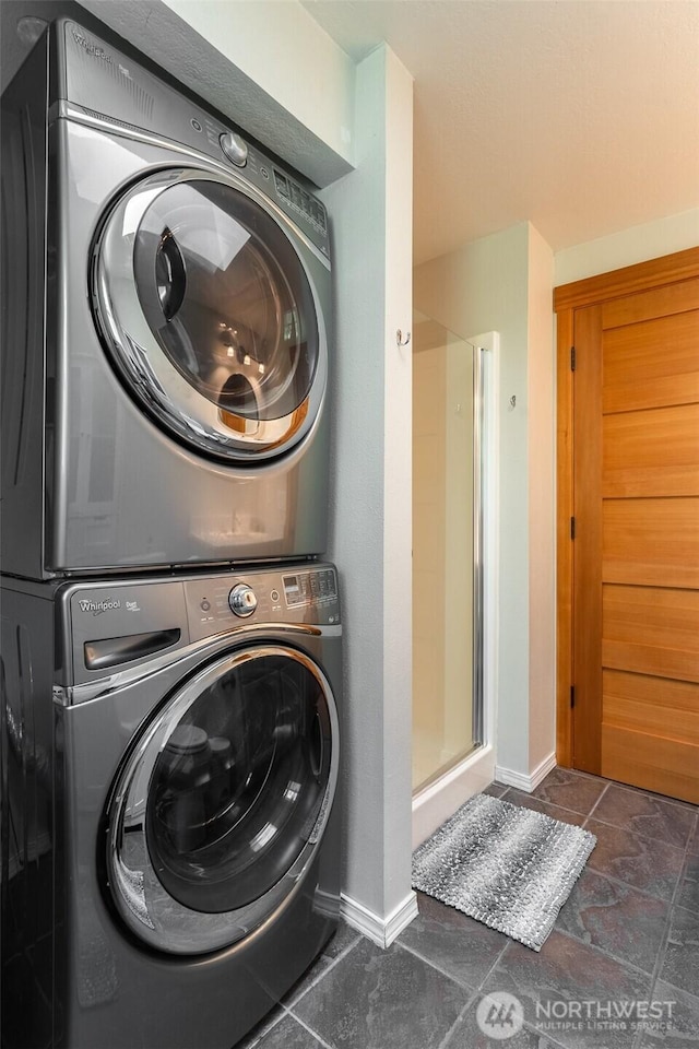 2 Greene Point Rd, Bellingham, WA 98229 - laundry room featuring stacked washer and clothes dryer and baseboards
