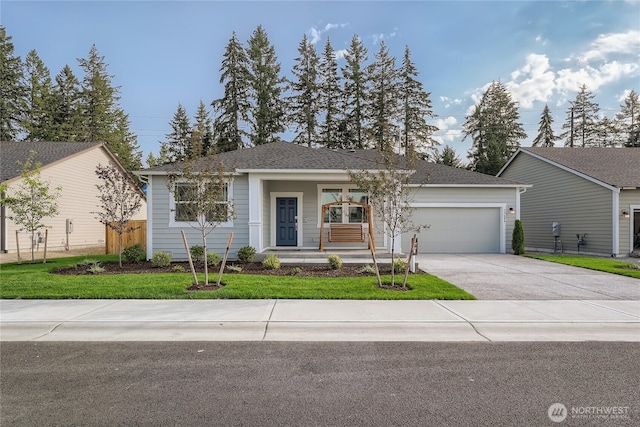 13461 192nd St E, Graham, WA 98338 - ranch-style home featuring a garage, concrete driveway, a front lawn, and covered porch