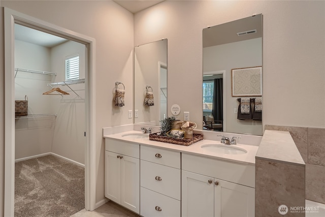 13461 192nd St E, Graham, WA 98338 - bathroom featuring double vanity and a spacious closet