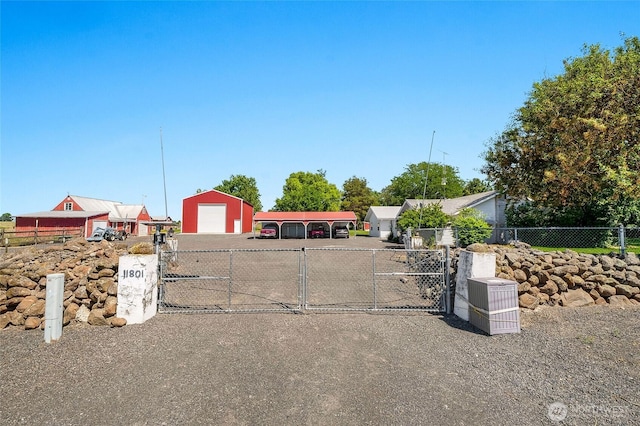 11801 Rd K NE, Moses Lake, WA 98837 - view of front of home featuring a gate, a garage, and driveway