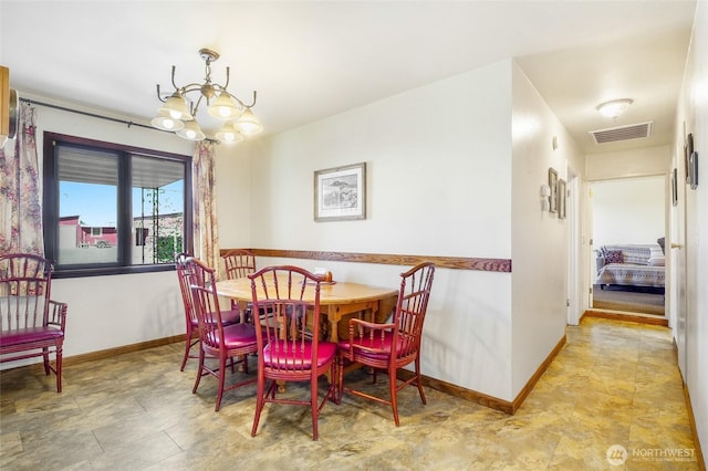 11801 Rd K NE, Moses Lake, WA 98837 - dining space featuring a chandelier and baseboards