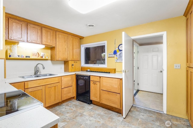 11801 Rd K NE, Moses Lake, WA 98837 - kitchen featuring black dishwasher, a sink, light countertops, open shelves, and stone finish floors