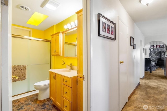 11801 Rd K NE, Moses Lake, WA 98837 - bathroom featuring vanity, a shower with shower door, and toilet