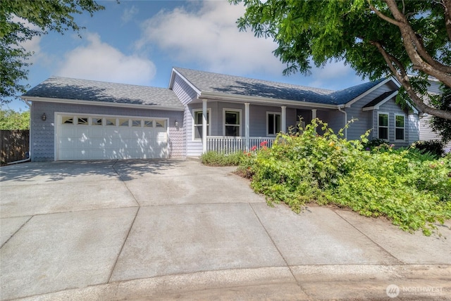 78 Cranbrook Ln, Walla Walla, WA 99362 - ranch-style home with a porch, a garage, concrete driveway, and a shingled roof