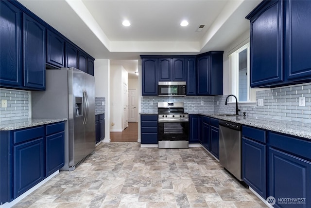 78 Cranbrook Ln, Walla Walla, WA 99362 - kitchen with stainless steel appliances, blue cabinets, light stone countertops, and recessed lighting