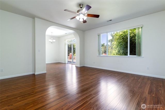 78 Cranbrook Ln, Walla Walla, WA 99362 - unfurnished room featuring arched walkways, a chandelier, dark wood-style flooring, and a ceiling fan