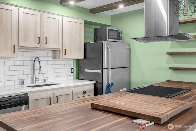 3425 Colby Ave Unit 601, Everett, WA 98201 - kitchen featuring island range hood, stainless steel appliances, wood counters, and tasteful backsplash