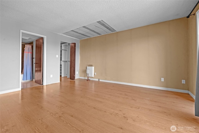 3425 Colby Ave Unit 601, Everett, WA 98201 - spare room featuring wood finished floors and a textured ceiling