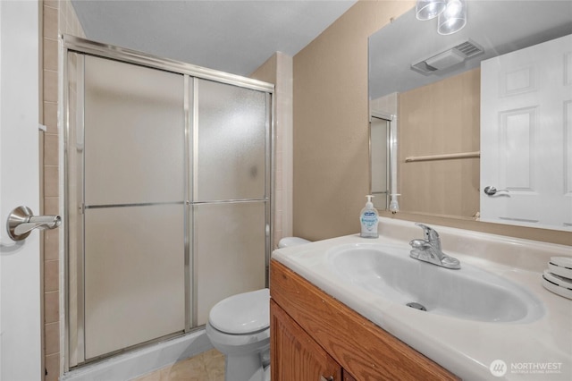 3425 Colby Ave Unit 601, Everett, WA 98201 - full bathroom featuring vanity, a shower stall, and tile patterned floors