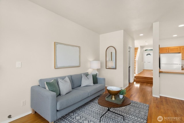 212 27th Ave E, Seattle, WA 98112 - living area with baseboards, light wood finished floors, and recessed lighting