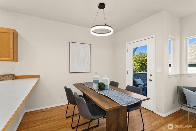 212 27th Ave E, Seattle, WA 98112 - dining area featuring light wood-style flooring, plenty of natural light, and baseboards