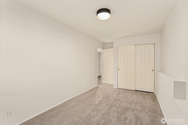 212 27th Ave E, Seattle, WA 98112 - unfurnished bedroom with carpet floors, baseboards, and a closet