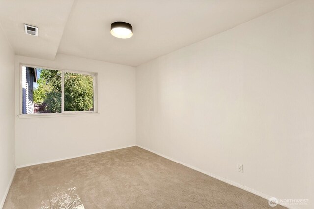 212 27th Ave E, Seattle, WA 98112 - empty room with carpet flooring and baseboards