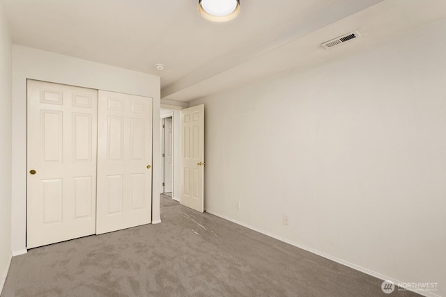 212 27th Ave E, Seattle, WA 98112 - unfurnished bedroom featuring baseboards, a closet, and carpet