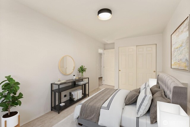 212 27th Ave E, Seattle, WA 98112 - bedroom with light carpet, a closet, and baseboards