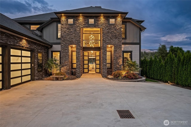 106 Shypoke Pl, Entiat, WA 98822 - view of front facade featuring stone siding, board and batten siding, and driveway