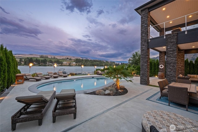106 Shypoke Pl, Entiat, WA 98822 - pool at dusk with a patio and a water view