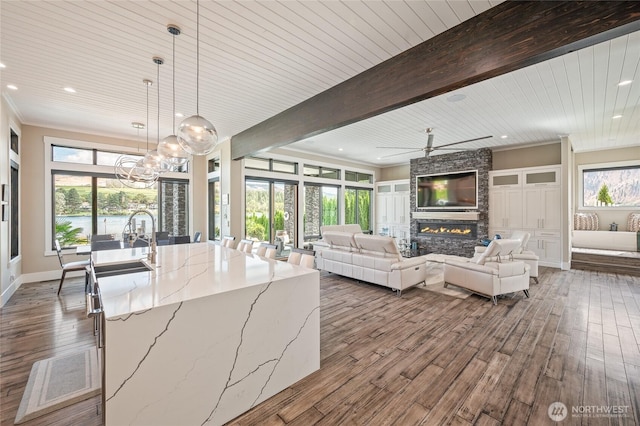 106 Shypoke Pl, Entiat, WA 98822 - kitchen featuring dark wood finished floors, a fireplace, a chandelier, light stone counters, and recessed lighting