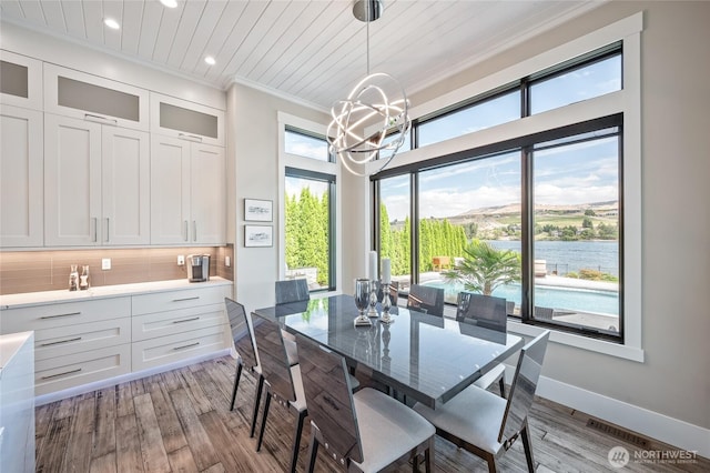 106 Shypoke Pl, Entiat, WA 98822 - dining space with a chandelier, crown molding, recessed lighting, light wood-style flooring, and baseboards