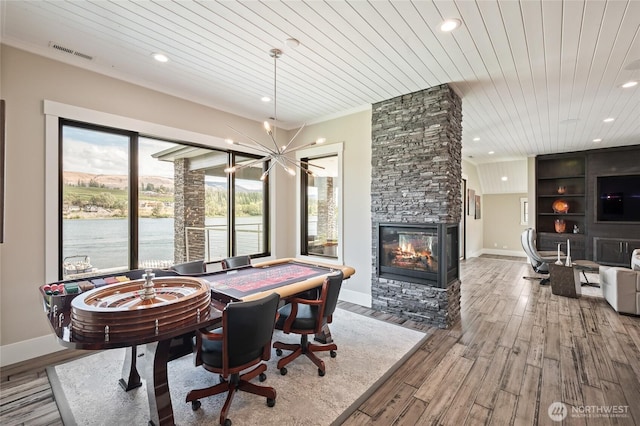 106 Shypoke Pl, Entiat, WA 98822 - dining area featuring wooden ceiling, a stone fireplace, wood finished floors, recessed lighting, and baseboards