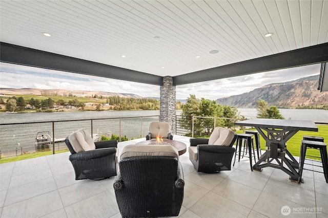 106 Shypoke Pl, Entiat, WA 98822 - view of patio with a water and mountain view and a fire pit