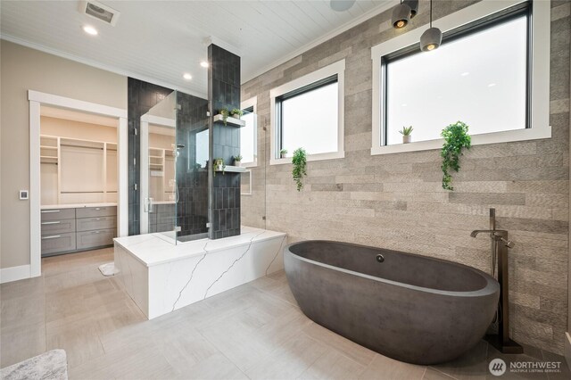 106 Shypoke Pl, Entiat, WA 98822 - full bath with a freestanding bath, a spacious closet, tile walls, crown molding, and vanity