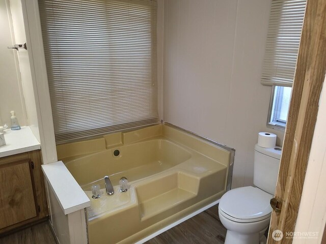 2200 196th St SE Unit 45, Bothell, WA 98012 - full bathroom with toilet, a bath, vanity, and wood finished floors