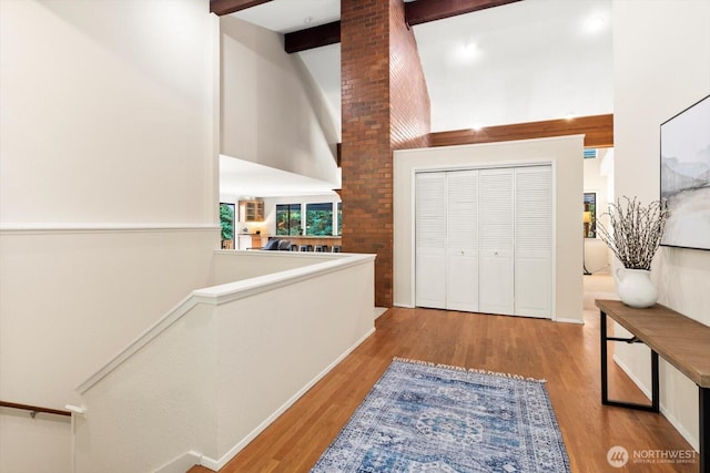 21907 3rd Ave SE, Bothell, WA 98021 - entrance foyer featuring high vaulted ceiling, wood finished floors, and beam ceiling