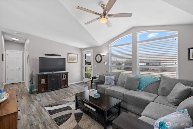 207 Moon River Vw SW, Mattawa, WA 99349 - living room featuring a ceiling fan, light wood finished floors, vaulted ceiling, and baseboards