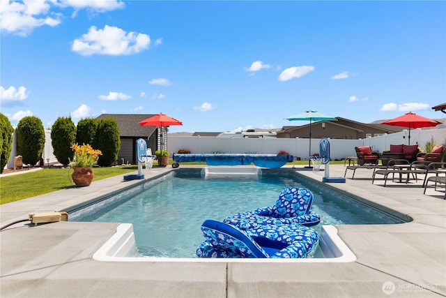 207 Moon River Vw SW, Mattawa, WA 99349 - view of swimming pool featuring a fenced backyard, a patio area, and an outdoor structure