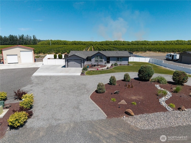 207 Moon River Vw SW, Mattawa, WA 99349 - view of front facade featuring concrete driveway, a detached garage, and an outdoor structure
