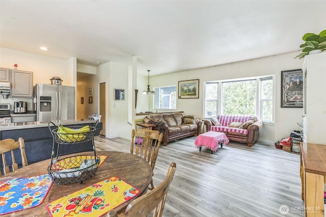 642 Sprague Valley Dr, Maple Falls, WA 98266 - dining area featuring plenty of natural light, light wood finished floors, and a chandelier