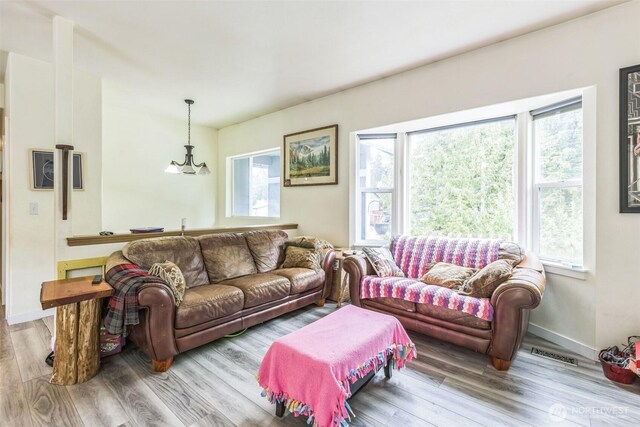 642 Sprague Valley Dr, Maple Falls, WA 98266 - living area featuring wood finished floors, healthy amount of natural light, and baseboards
