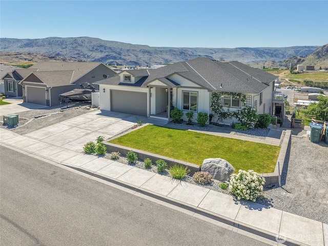 1080 Sunset Ln, Chelan, WA 98816 - view of front of property with a mountain view, a garage, driveway, and a front yard