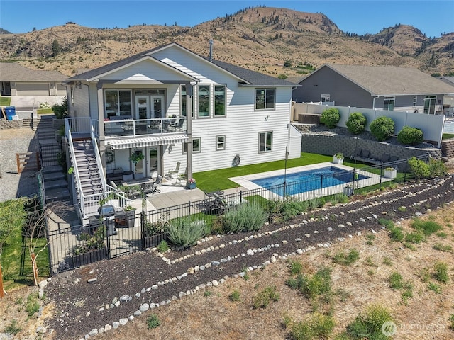 1080 Sunset Ln, Chelan, WA 98816 - rear view of house with a fenced backyard, stairs, a patio, and a mountain view