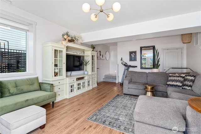 1080 Sunset Ln, Chelan, WA 98816 - living room with a chandelier, light wood-style floors, and baseboards